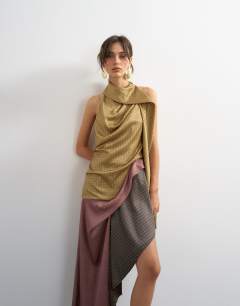 Model wearing Premium satin halter asymmetric mini dress with scarf detail in geo scarf print