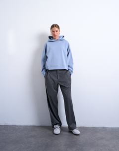 Model wearing Premium scuba oversized jean grazer hoodie in blue