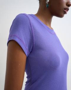 Model wearing Premium sheer rib short sleeve top in purple