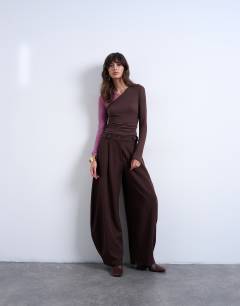 Model wearing Premium sheer rib v-neck double layer long sleeve top in pink and chocolate