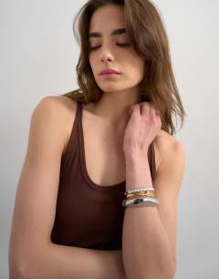 Model wearing Premium spaghetti strap scoop racer vest in brown