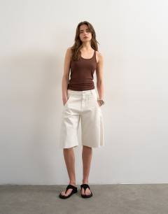 Model wearing Premium spaghetti strap scoop racer vest in brown