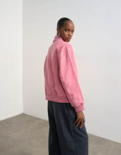Model wearing Premium suede bomber jacket in pink