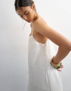Model wearing Premium textured chuck on maxi sundress in white