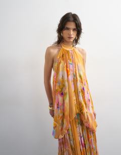 Model wearing Premium viscose blouson halter neck maxi dress with open back and train in handpainted floral print