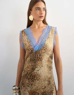 Model wearing Premium viscose lace insert pintucked maxi tea dress in animal print with contrast blue lace