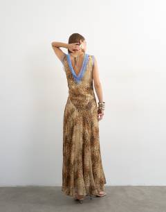 Model wearing Premium viscose lace insert pintucked maxi tea dress in animal print with contrast blue lace