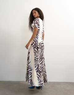 Model wearing Premium viscose satin dropped tie waist maxi dress in mono zebra