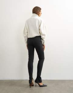 Model wearing Premium Zip Cuff Trousers In Black
