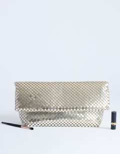 Model wearing Prince Chainmail oversized clutch bag in gold