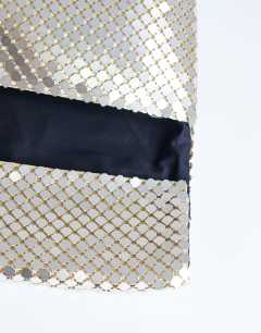 Model wearing Prince Chainmail oversized clutch bag in gold