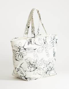 Model wearing Printed canvas tote bag in floral