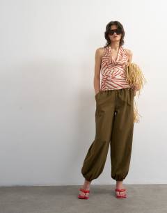 Model wearing Printed cowl neck halter top in multi