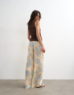 Model wearing Printed floral jaquard satin wide leg trouser in multi