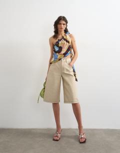 Model wearing Printed knot detail one shoulder top in multi