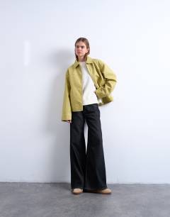 Model wearing PU zip through jacket in buttermilk