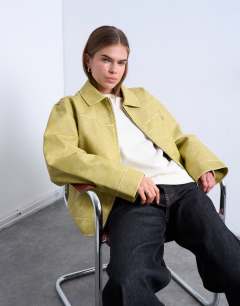 Model wearing PU zip through jacket in buttermilk