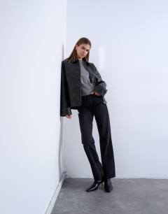 Model wearing PU zip through jacket in washed black