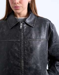 Model wearing PU zip through jacket in washed black