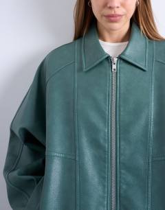 Model wearing Pu zip through seam detail jacket in teal