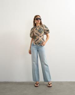 Model wearing Puff sleeve wrap hem detail top in green check