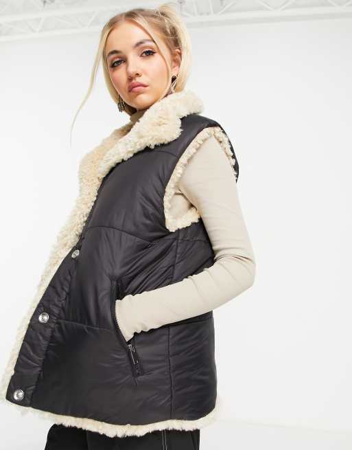 Topshop puffer vest jacket with reversible sherpa lining in black | ASOS