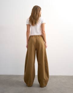 Model wearing Pull on barrel jean in cumin