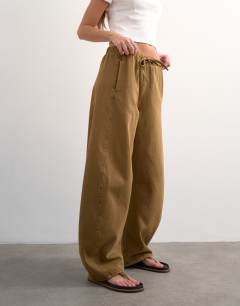 Model wearing Pull on barrel jean in cumin