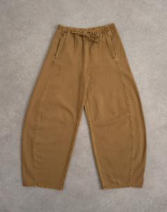 Model wearing Pull on barrel jean in cumin