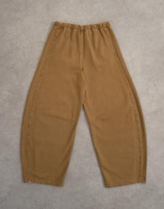 Model wearing Pull on barrel jean in cumin