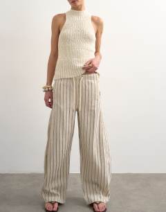 Model wearing Pull on barrel jean in ecru stripe