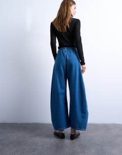Model wearing Pull on barrel jean in mid blue