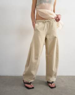 Model wearing Pull on barrel jean in oat