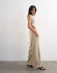 Model wearing Pull on barrel jean in oat