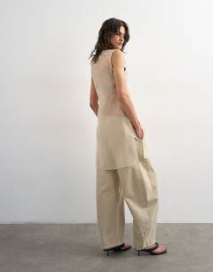 Model wearing Pull on barrel jean in oat