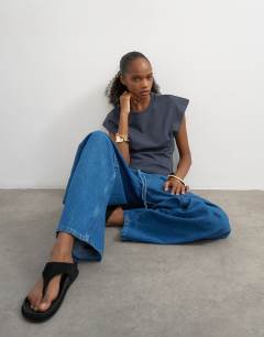 Model wearing Pull on barrel jean in rich blue