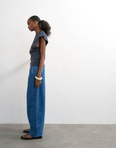 Model wearing Pull on barrel jean in rich blue