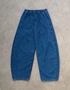 Model wearing Pull on barrel jean in rich blue