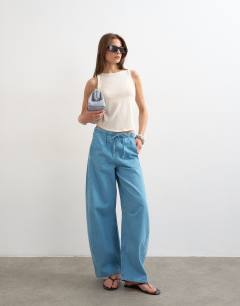 Model wearing Pull on barrel jean in summer blue 