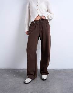 Model wearing Pull on jogger jean in chocolate brown