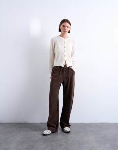 Model wearing Pull on jogger jean in chocolate brown