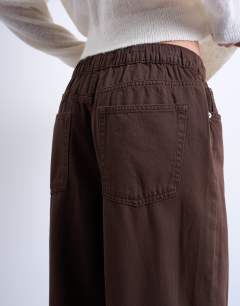 Model wearing Pull on jogger jean in chocolate brown