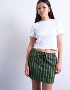 Model wearing Pull on utility skirt in multi stripe