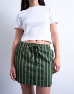 Model wearing Pull on utility skirt in multi stripe