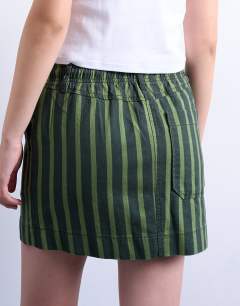 Model wearing Pull on utility skirt in multi stripe