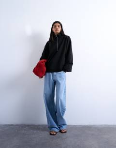 Model wearing Quarter zip sweat in black