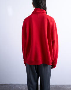 Model wearing Quarter zip sweat in red
