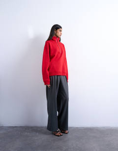 Model wearing Quarter zip sweat in red