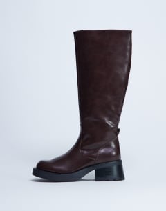 Model wearing Rachel knee high chunky heeled boot in chocolate