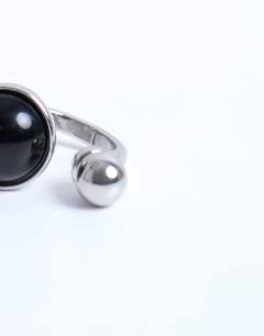 Model wearing Rae stainless steel ring with semi precious stone in silver & black
